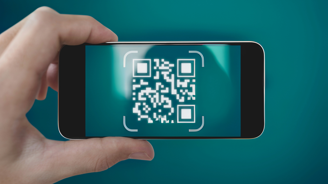 Guest scanning QR code at FIOH installation